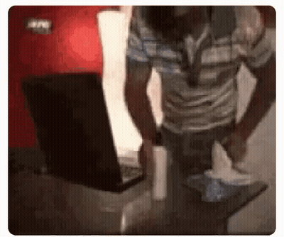 Man Holding Tissue In Front Of Laptop GIF