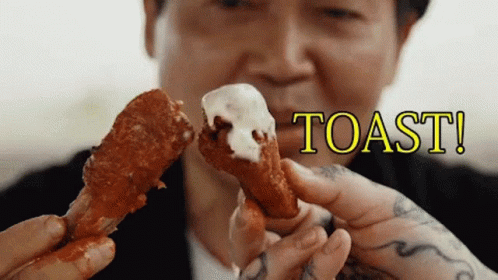 Man Holding Toasted Chicken Wing GIF