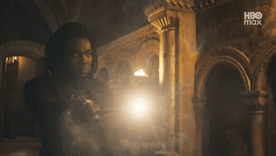 Man Holding Torch In Dark Room With HBO Max Logo GIF