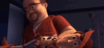 Man Holding Toy Story Woody Doll GIF