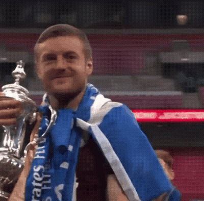 Man Holding Trophy And Wearing Blue Emirates Scarf GIF