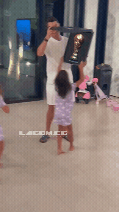 Man Holding Trophy Girl Reaching For Lacom.co Sign GIF