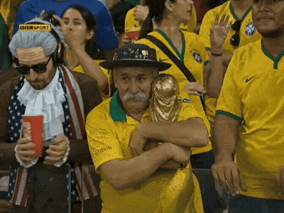 Man Holding Trophy In Crowd With BBC Sport Logo GIF