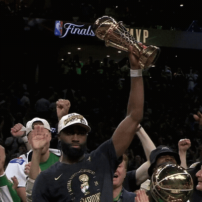Man Holding Trophy In Front Of NBA Finals Sign GIF