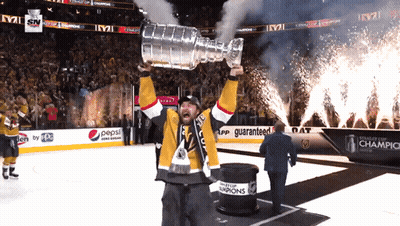 Man Holding Trophy In Front Of Pepsi Sign GIF