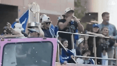 Man Holding Trophy On Pink Truck GIF