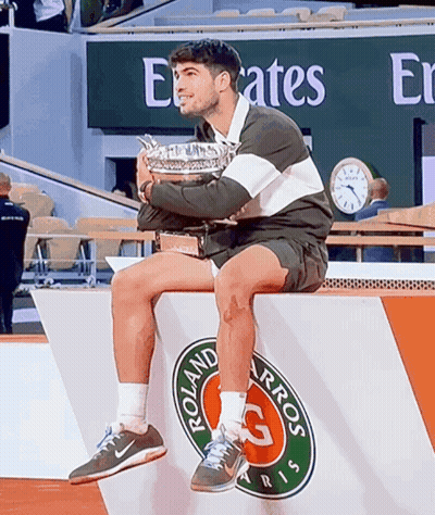 Man Holding Trophy On Podium Emirates Sign GIF