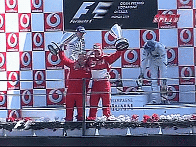 Man Holding Trophy On Podium Saying Speed GIF