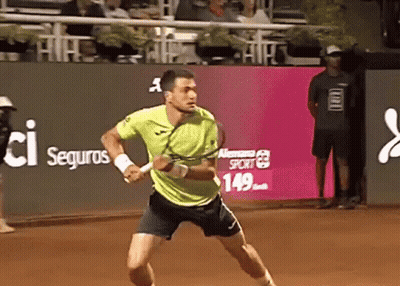 Man Holding Trophy Over Head With Crowd Watching GIF