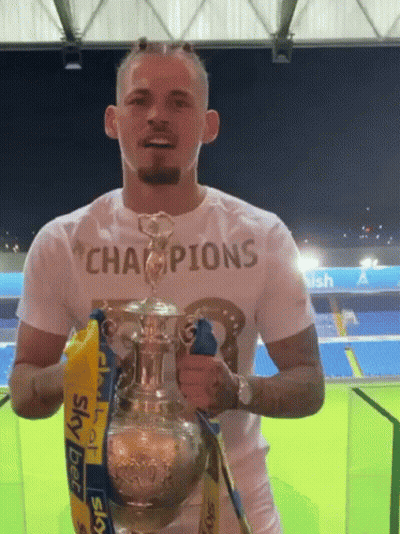 Man Holding Trophy Saying Champions GIF