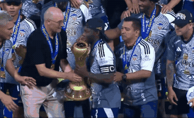 Man Holding Trophy Saying EC GIF