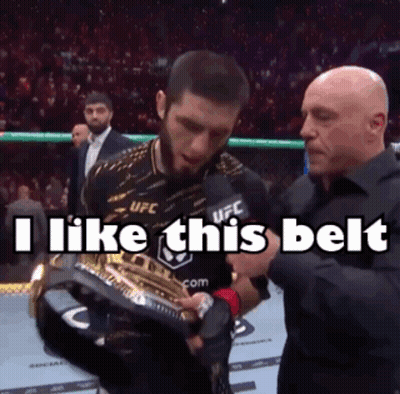 Man Holding Trophy Saying I Like This Belt
