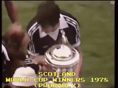 Man Holding Trophy Saying Scotland World Cup Winners Probably GIF