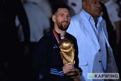 Man Holding Trophy With Kapwing Logo GIF