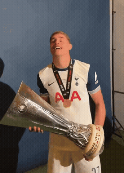 Man Holding Trophy With Medal GIF