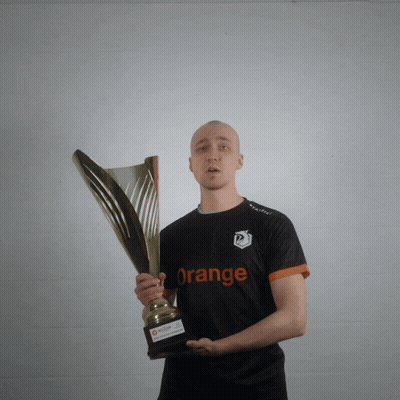 Man Holding Trophy With Orange Shirt GIF