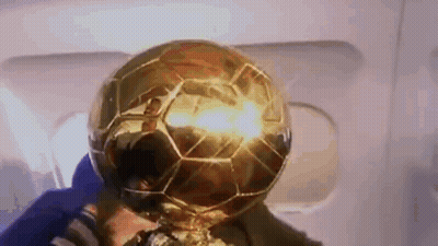 Man Holding Trophy With Soccer Ball GIF