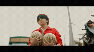 Man Holding Two Watermelons