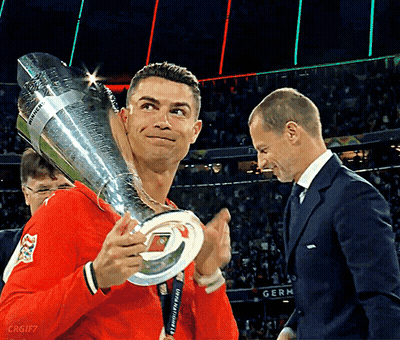 Man Holding UEFA Champions League Trophy GIF