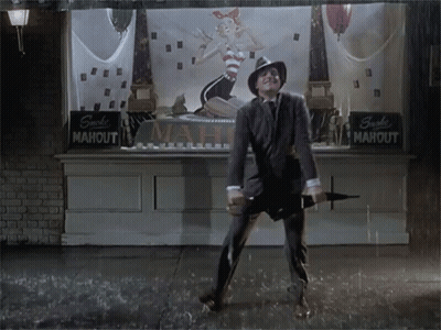 Man Holding Umbrella In Front Of Mahout Sign GIF
