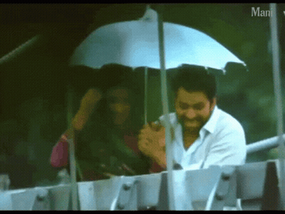 Man Holding Umbrella Over Woman Saying Man GIF