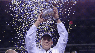 Man Holding Up Champions Trophy GIF