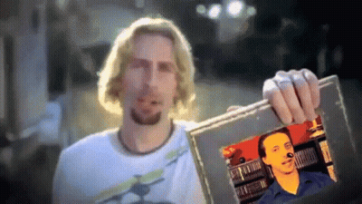 Man Holding Up Picture Of Bearded Man GIF