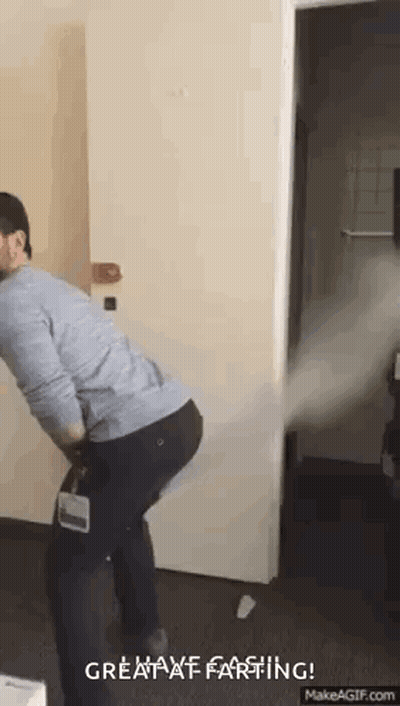 Man Holding Vacuum Cleaner In Room GIF