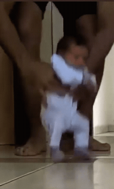 Man Holding Walking Baby GIF