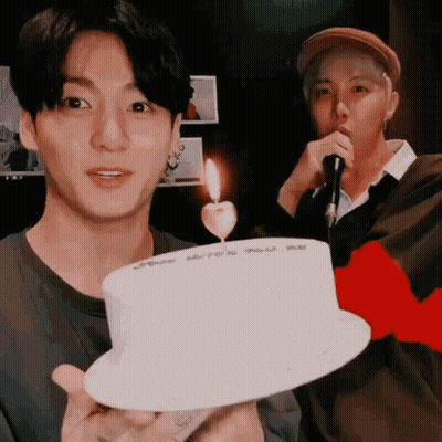Man Holding White Cake With Candle GIF