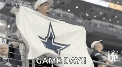 Man Holding White Flag With Cowboy Star In Stadium GIF
