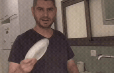Man Holding White Plate GIF