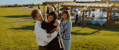 Man Holding Woman In Arms GIF