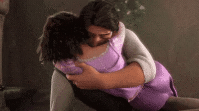Man Holding Woman In Arms GIF