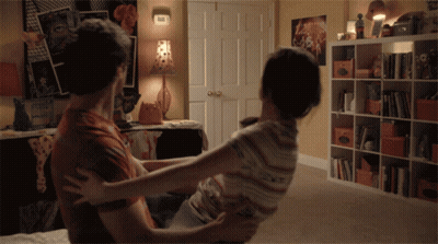 Man Holding Woman In Arms GIF