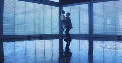 Man Holding Woman In Room With Windows GIF