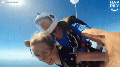 Man Holding Woman In The Air Happily GIF