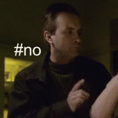 Man Holding Woman's Arm In Dark Room GIF