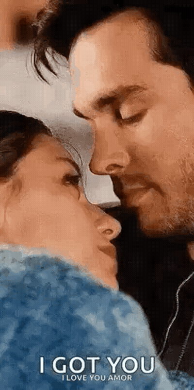 Man Holding Woman's Face While Kissing GIF