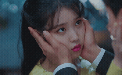 Man Holding Woman's Face With Hands GIF