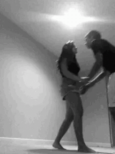 Man Holding Woman While Dancing GIF