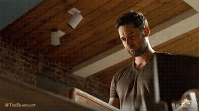 Man Holding Wood With Brick Wall And Wooden Ceiling GIF