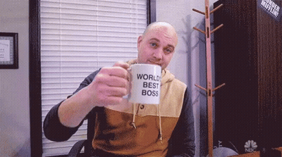 Man Holding World's Best Boss Mug GIF