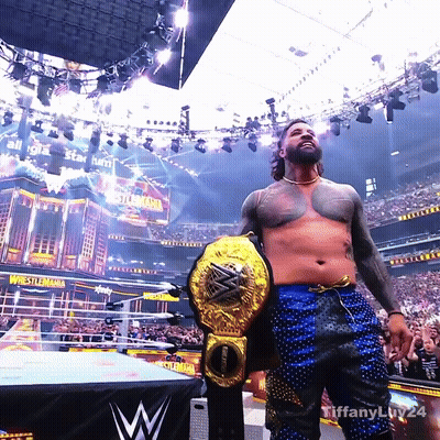 Man Holding Wrestling Championship Belt GIF