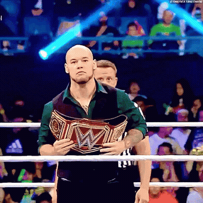 Man Holding Wrestling Championship Belt In Boxing Ring GIF