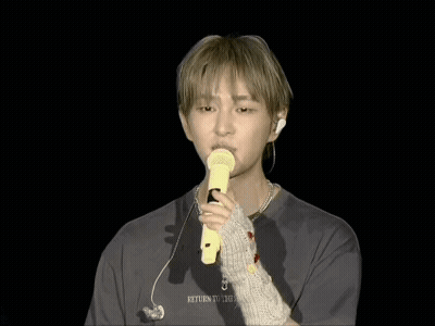 Man Holding Yellow Microphone Saying Return GIF