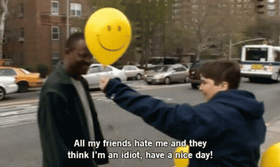Man Holding Yellow Smiley Balloon Says All My Friends Hate Me GIF