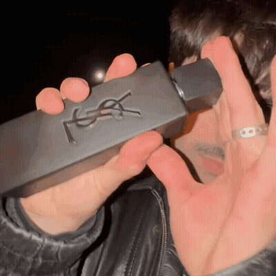 Man Holding YSL Perfume Bottle GIF