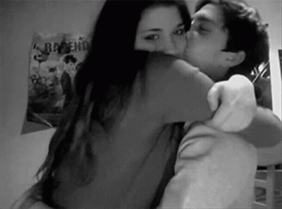 Man Hugging And Kissing Woman On Cheek GIF