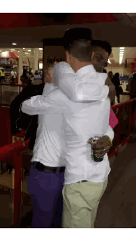 Man Hugging Man In Front Of Infiniti Sign Sticker